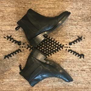 Black flat leather booties